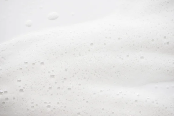 Abstrakte Hintergrund weißer Seifenschaum Textur. Shampoo-Schaum mit — Stockfoto