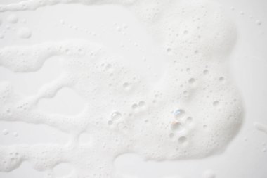 Arka plan beyaz sabunlu köpük doku. Şampuan köpük ile 