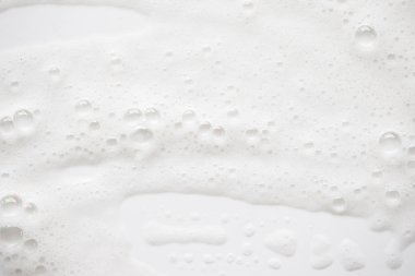 Arka plan beyaz sabunlu köpük doku. Şampuan köpük ile 