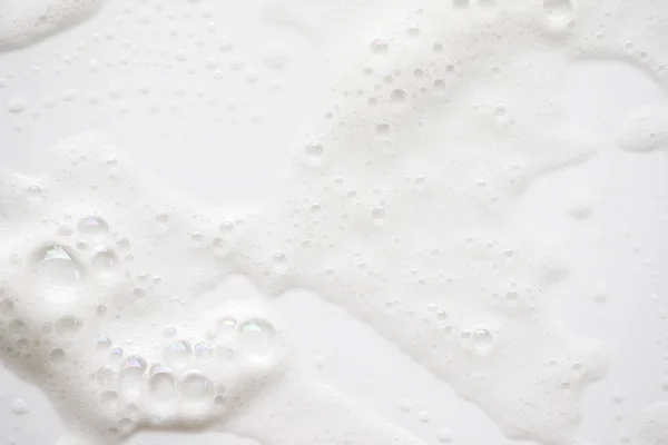 Abstracte witte zeep schuim achtergrondstructuur. Shampoo schuim met — Stockfoto