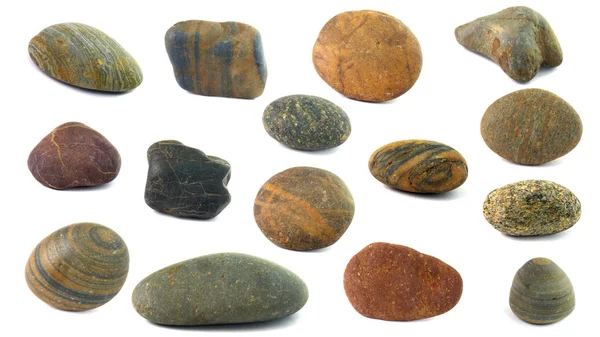 Sbírka kamenů. Různé druhy oblázků na bílém pozadí. — Stock fotografie