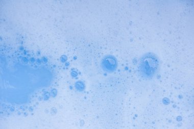 Soyut arka plan beyaz sabunlu köpük dokusu. Köpüklü şampuan köpüğü.