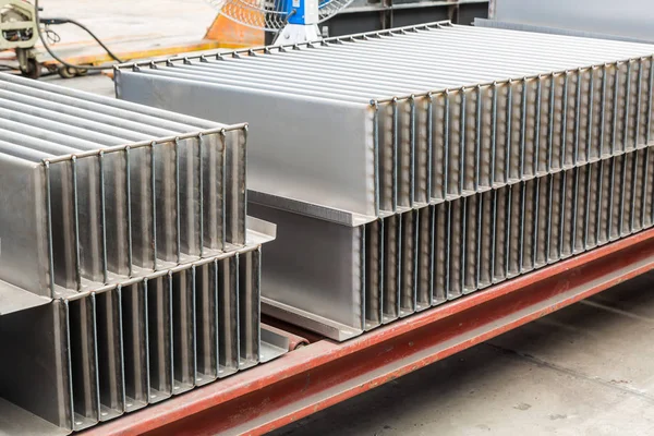 Corrugated fins for oil immersed transformer tank in metal workshop manufacturing