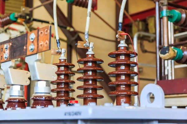 Three phase oil immersed transformer under winding resistance measurement after short circuit withstanding type test, measuring cables are connected to HV bushing