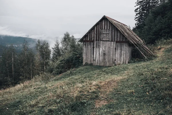 Gray wooden house with boards in the Carpathian mountains. Yaremche — Stock Photo, Image