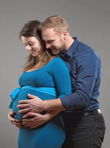 Pregnant Woman and her Man touching the Belly. — Stock Photo, Image