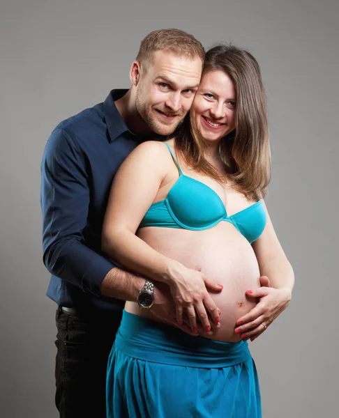 Pregnant Woman and her Man touching the Belly. — Stock Photo, Image