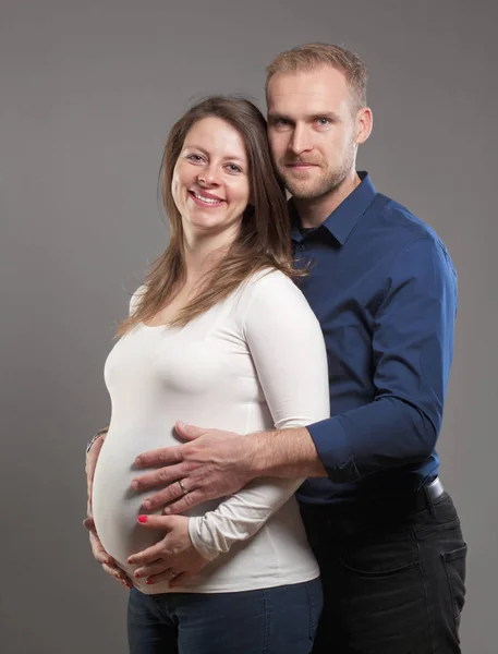 Pregnant Woman and her Man touching the Belly. — Stock Photo, Image