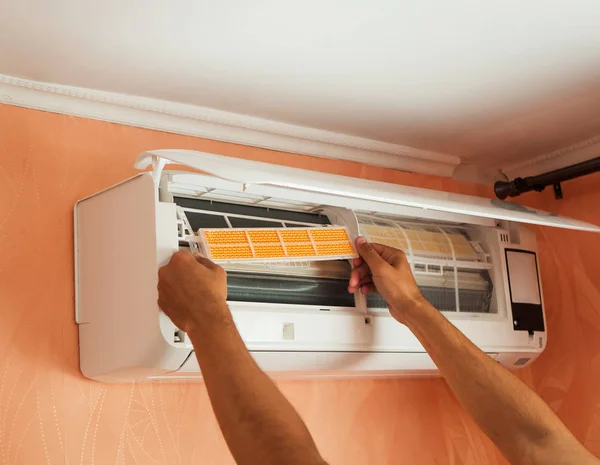 Checking air conditioner filter. The Concept of Safe and Healthy Breathing