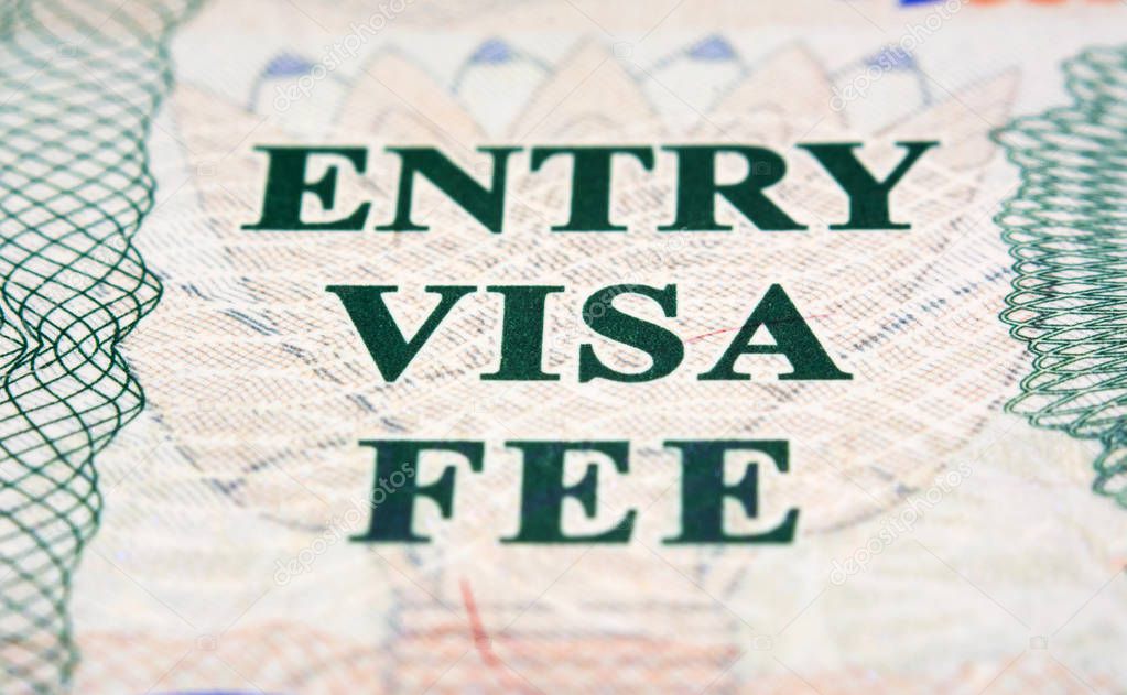 Entry visa fee stamp in passport close-up