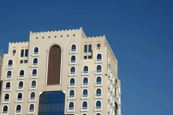 Hotel building with half-rounded windows in arabic style