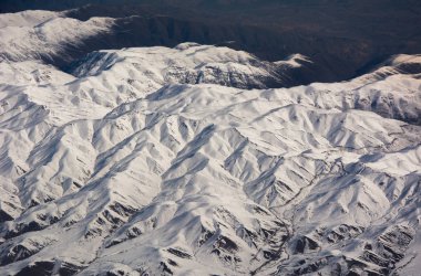 Kışın uçaktan karlı dağlar görünümü, İran Highlands