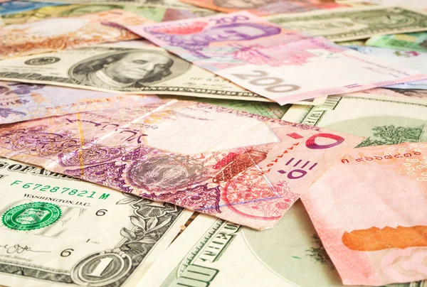 Background from paper money of the different countries (Dollar, Qatari riyal, hryvnia). Global currency — Stock Photo, Image