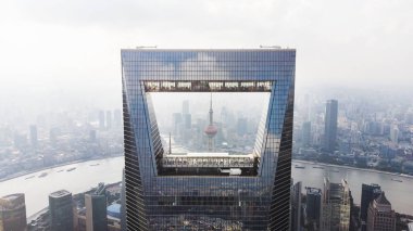Frame Of Shanghai Skyline. Oriental Pearl Tower Through Shanghai World Financial Center. clipart