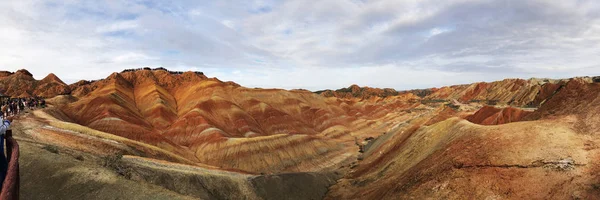 Panorama View of Rainbow Mountains Geological Park. Stripy Zhangye Danxia Landform Geological Park in Gansu Province, China. Valley on a Sunny Day.