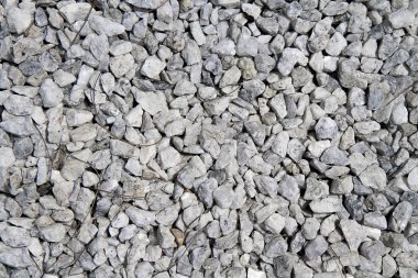 Doku arka plan beyaz ve gri küçük taşlar ve çakıl açık.