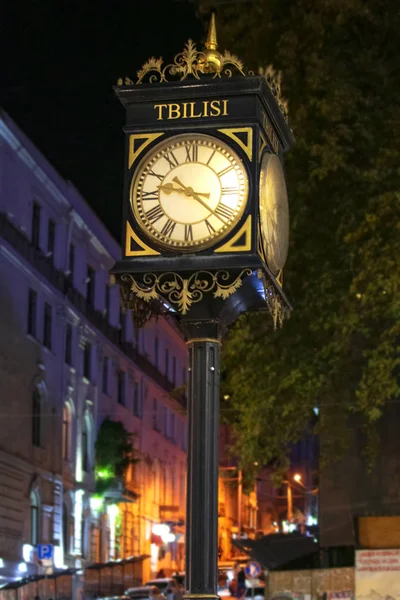 Vintage street clock on Shota Rustaveli avenue in Tbilisi, georgia. Night time