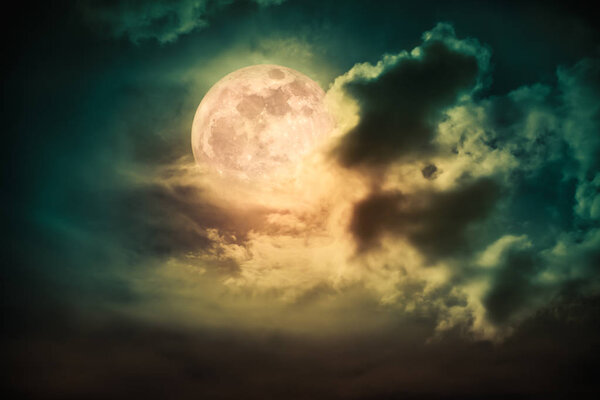 Attractive photo of cloudscape at nighttime. Night landscape of dark sky with bright full moon behind clouds, serenity nature background. The moon taken with my own camera.