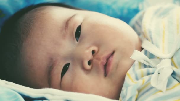 Close Face Two Month Adorable Asian Baby Relaxing Looking Camera — Stock Video