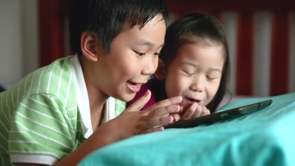 Asian Children Using Digital Tablet Happily Sister Smiling Cheering Her — Stock Video