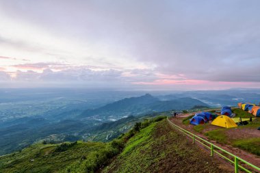 High view beautiful nature landscape of colorful sky during the sunrise from the campsite at Phu Thap Berk viewpoint, famous tourist attractions of Phetchabun Province, Thailand clipart