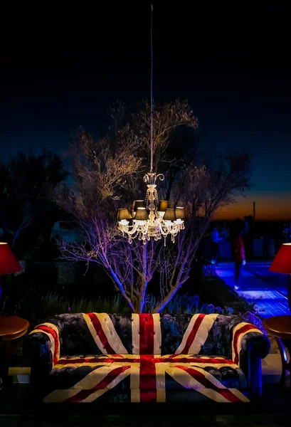 Union Jack British Flag couch and chandelier at outdoor corporate event gala dinner banquet