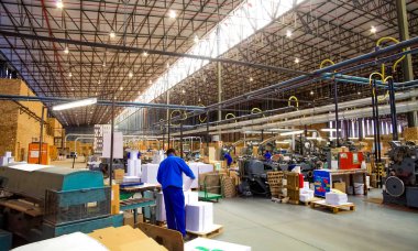 Johannesburg, South Africa - March 23 2011: Inside a Printing and Packaging Factory Facility clipart