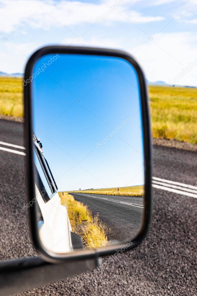 Rear view in a side Mirror of 4x4 vehicle