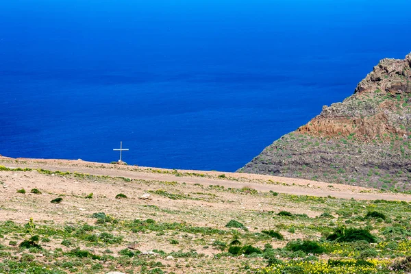 Tomb cross near gravel road, Lanzarote, Canaries