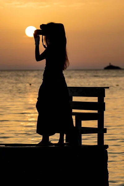 Beautiful silhouette at sunset golden sea water — Stock Photo, Image