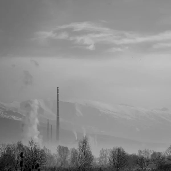 Hazy afternoon landscape with factory smoke — Stock Photo, Image