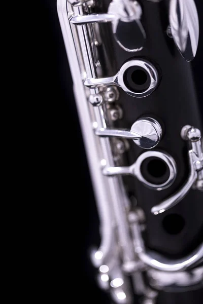 A new silver plated clarinet on a black background