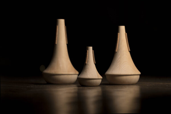 Music instrument mutes made out of wood.