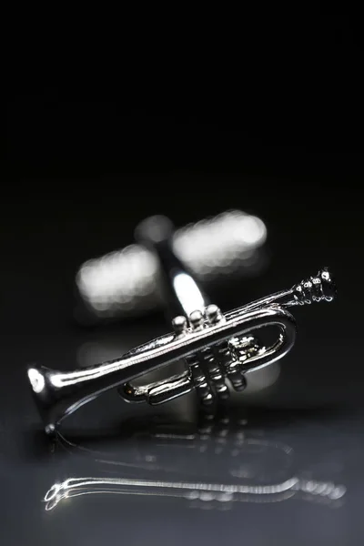 Trumpet Cufflink Reflective Background — Stock Photo, Image