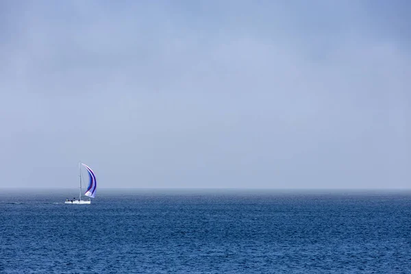 A sailboat or yacht in the ocean