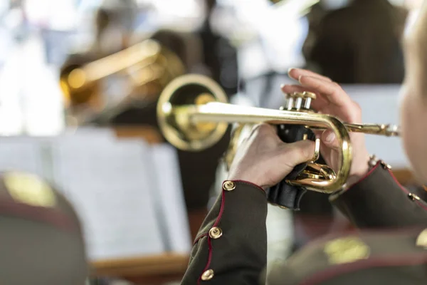 A person playing a trumpet