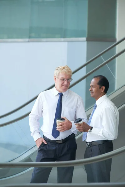 Two Business People Going Escalator Coffee Mugs — Stock Photo, Image