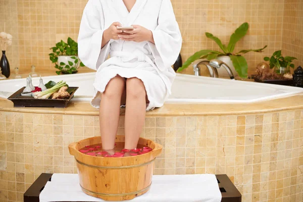 Cropped Image Woman Smartphone Sitting Feet Basin — Stock Photo, Image