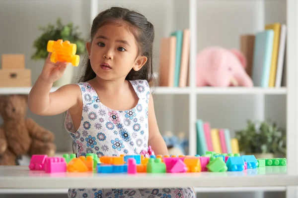Little Girl Playing Plastic Blocks Table Nursery Room — Stock Photo, Image