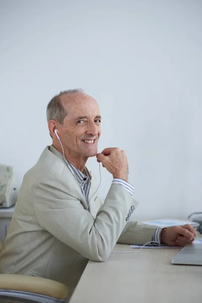Cheerful Aged Businessman Earphones Working His Table — Stock Photo, Image