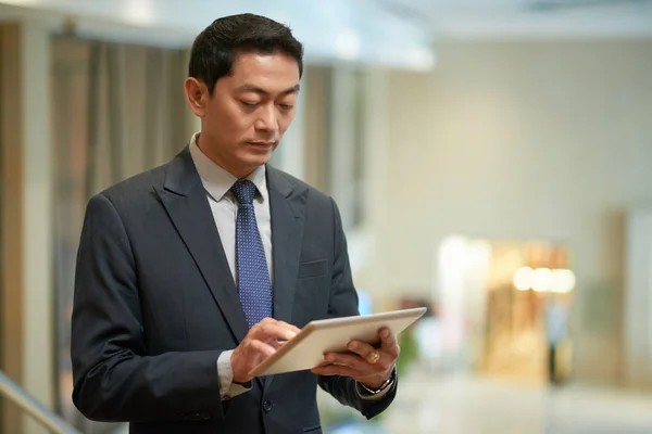 Vietnamese Business Executive Checking Information Tablet Computer — Stock Photo, Image