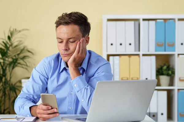 Bored Young Businessman Reading News Messages His Smartphone — Stock Photo, Image