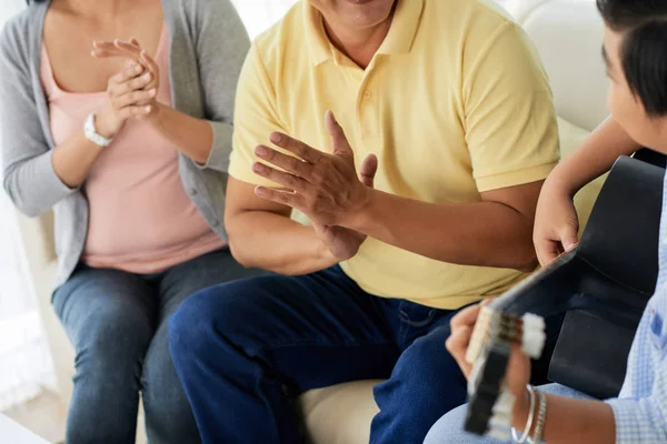 Boy Playing Guitar Parents Sitting Sofa Applauding — Stock Photo, Image