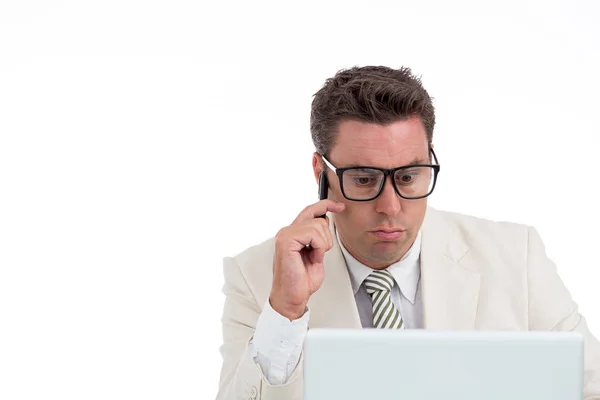 Pensive Businessman Using Laptop Talking Mobile — Stock Photo, Image
