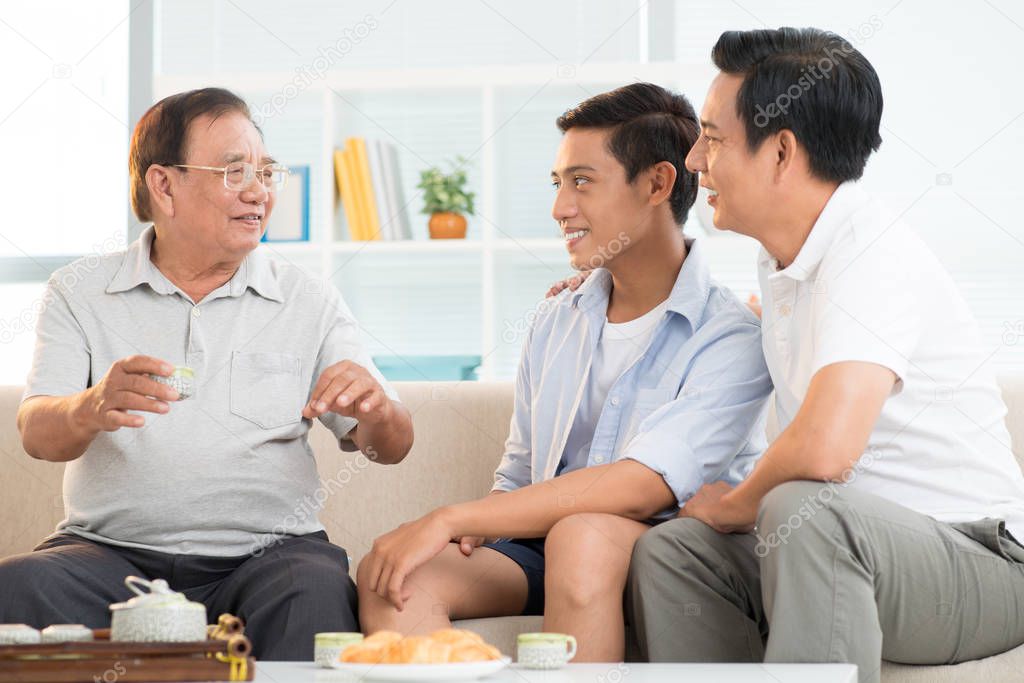 asian family at home, Happy grandfather talking to son and grandson