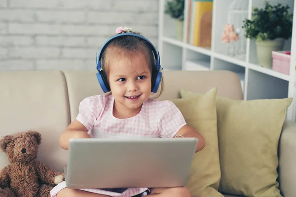 Little Mixed Race Girl Headphones Working Laptop Home Sofa Bear — Stock Photo, Image