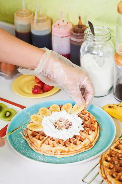 Cropped Image Woman Hand Decorating Waffles Cut Banana Slices — Stock Photo, Image