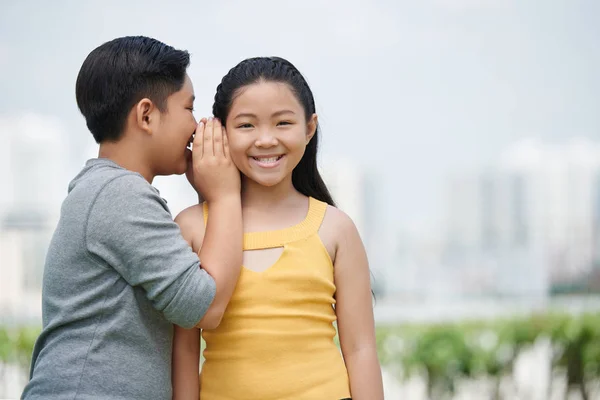 Asian Boy Telling Girl Secret — Stock Photo, Image