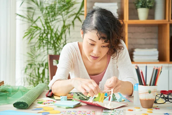 Concentrated Asian Woman Focused Making Greeting Card — Stock Photo, Image