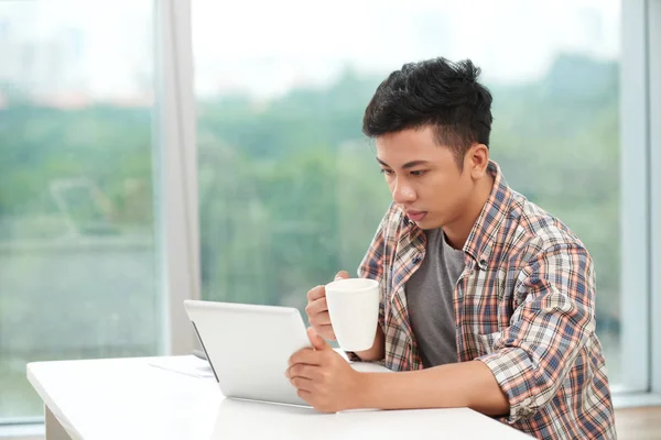 Young Asian Man Holding Cup Morning Coffee Reading News Digital — Stock Photo, Image